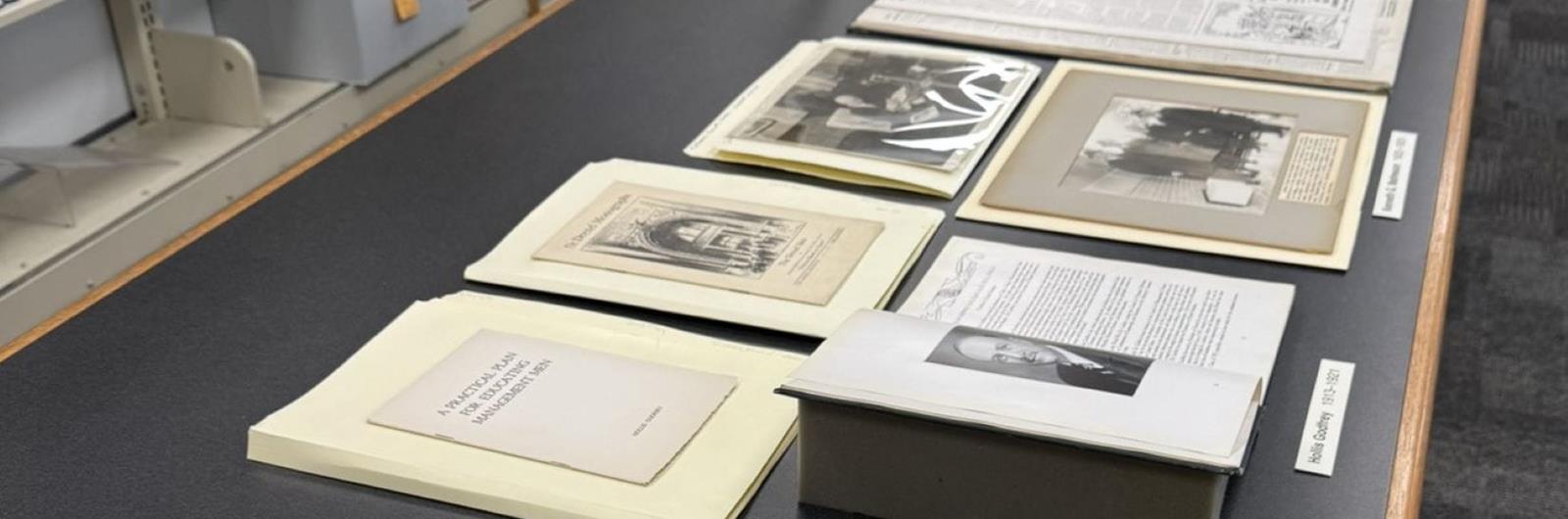 Papers and books on top of a table