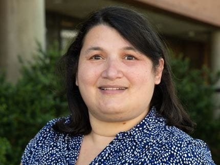 Headshot of Deborah Bishov outside the W. W. Hagerty Library. 