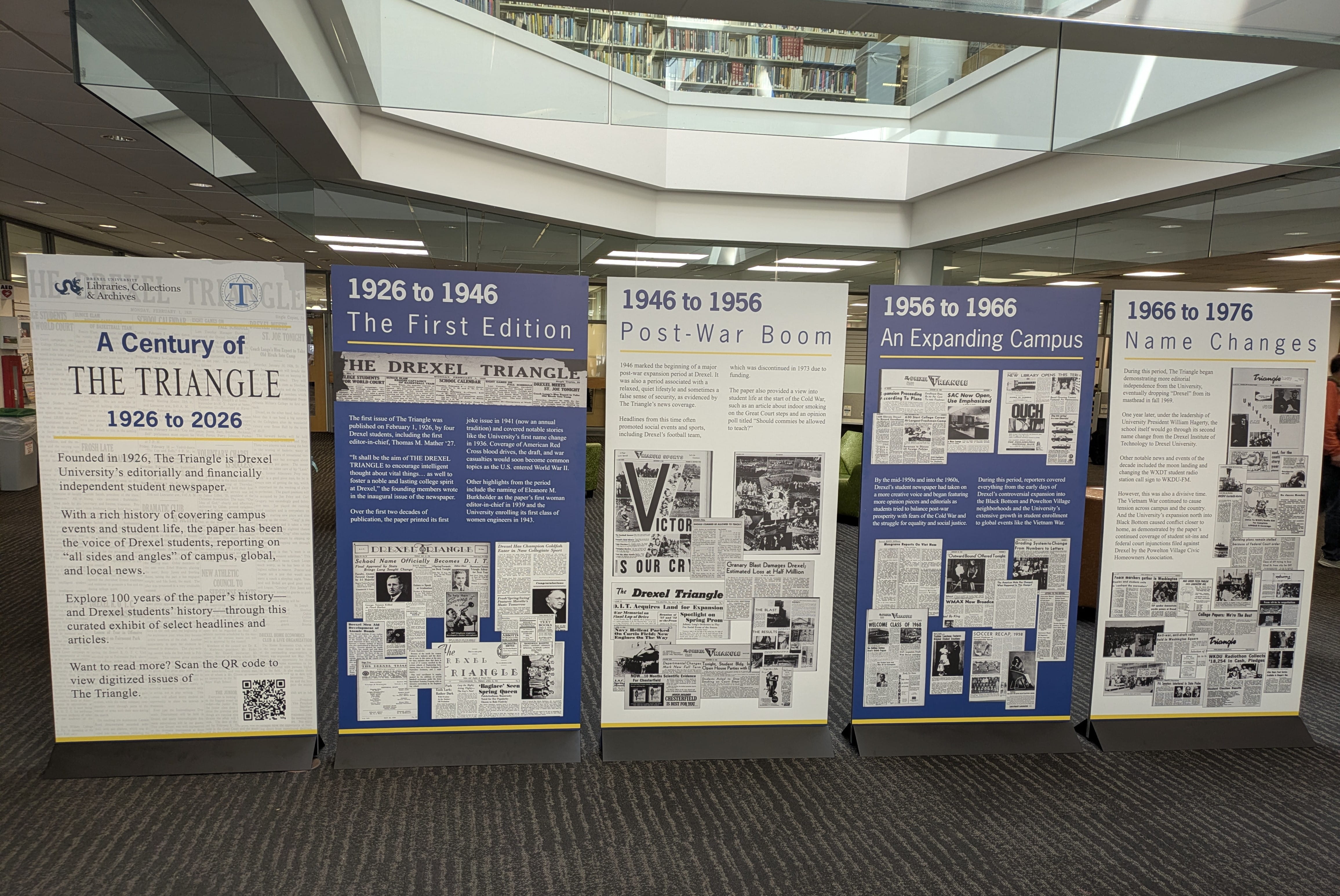 5 free-standing panels with information about The Triangle newspaper on them