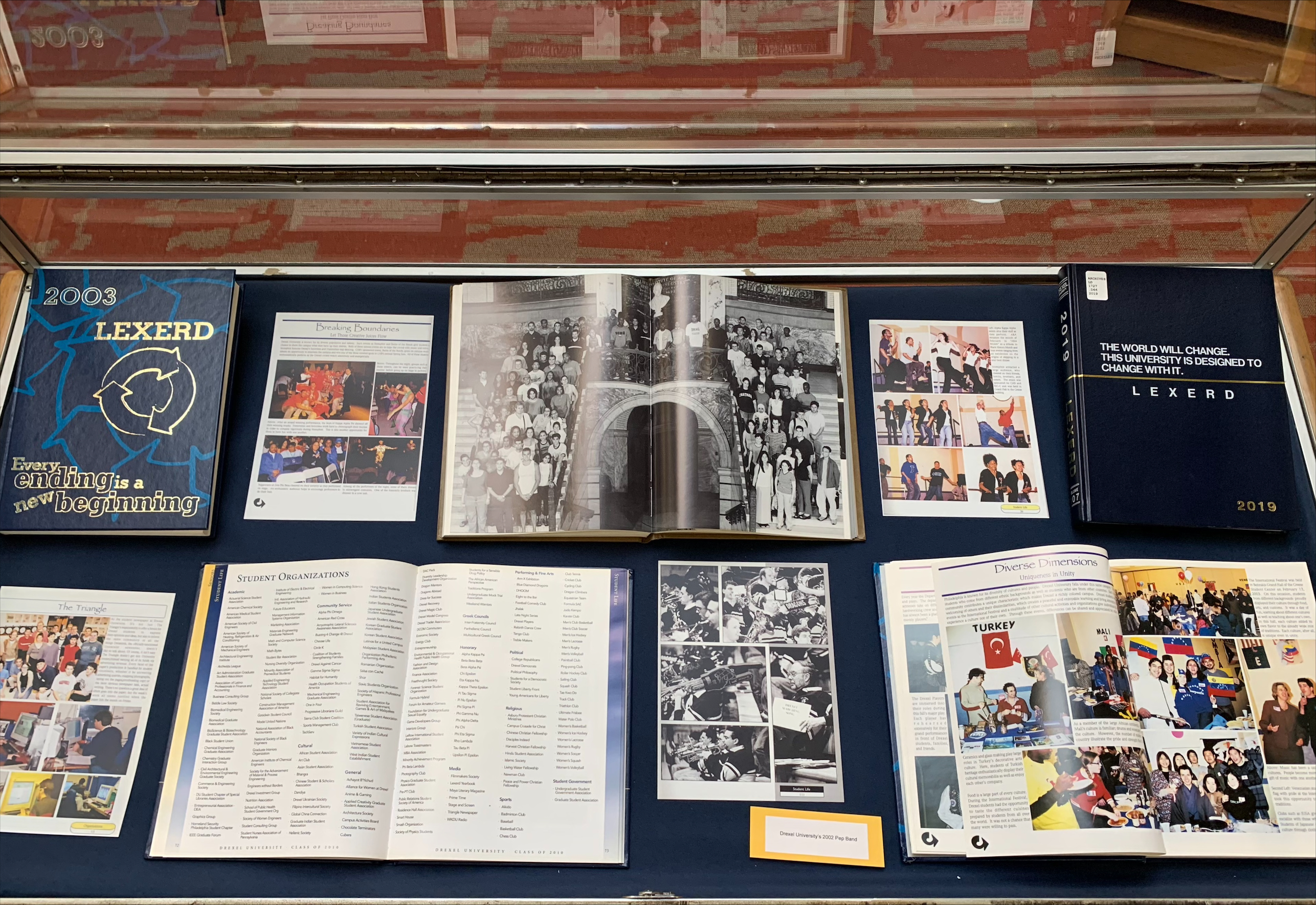 Copies of Drexel yearbooks in a display case