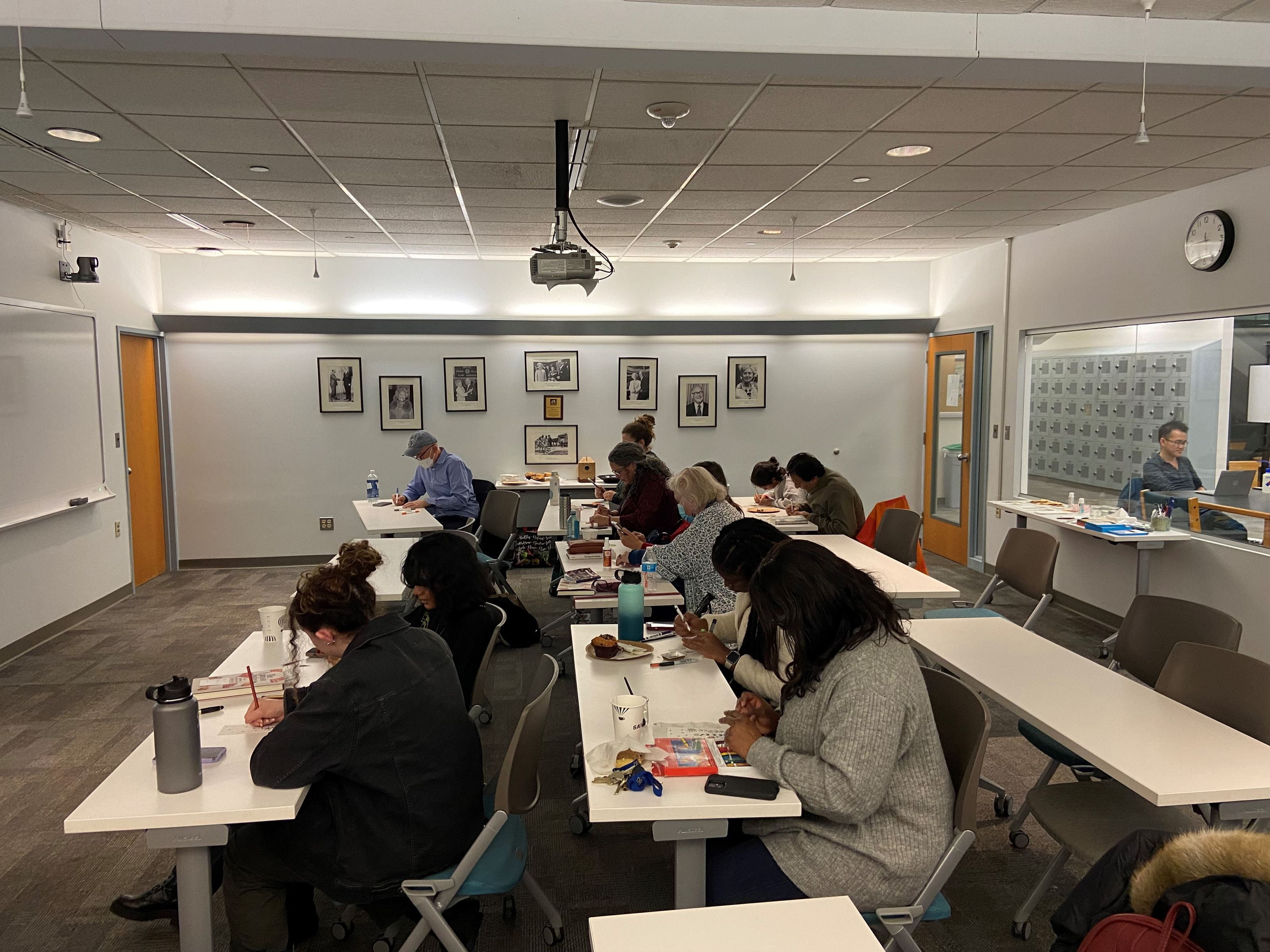 People draw in a classroom