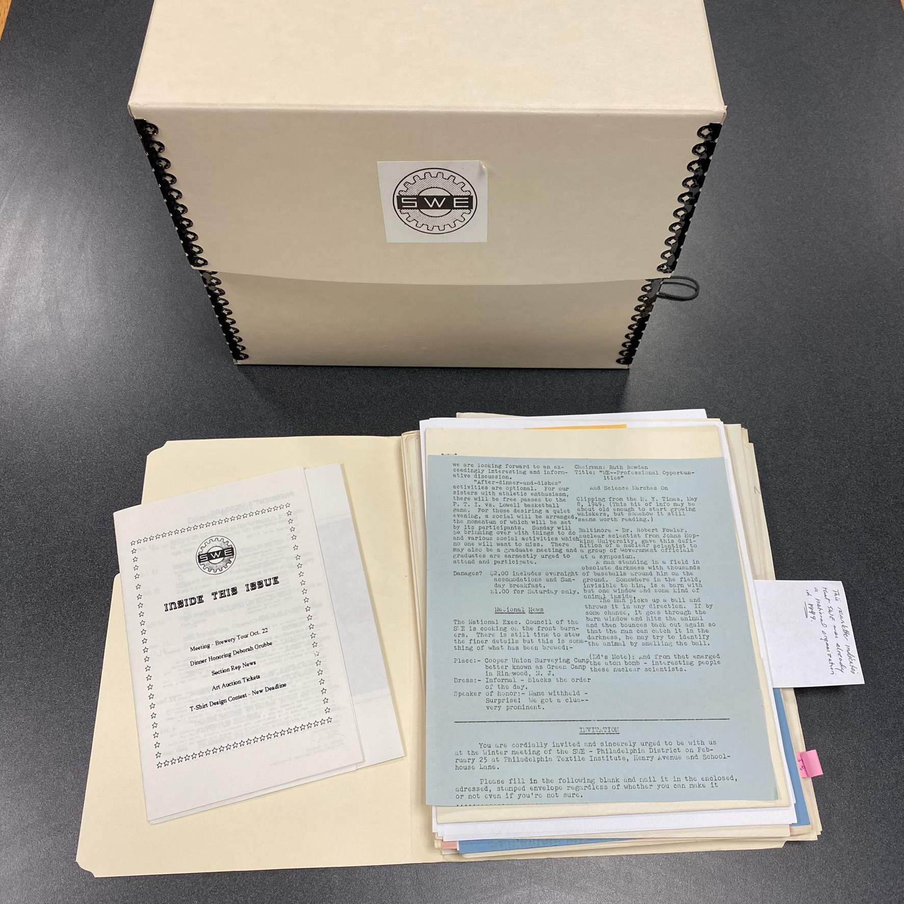 Files on a desk with an archival file box